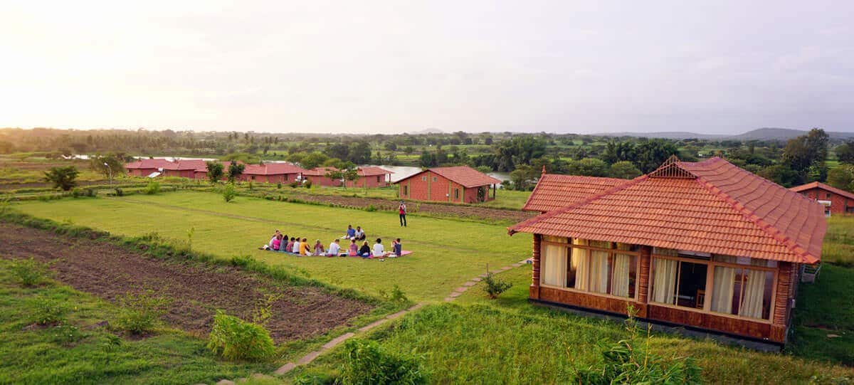 Yoga hall among the fields at sunset, Karnataka, India