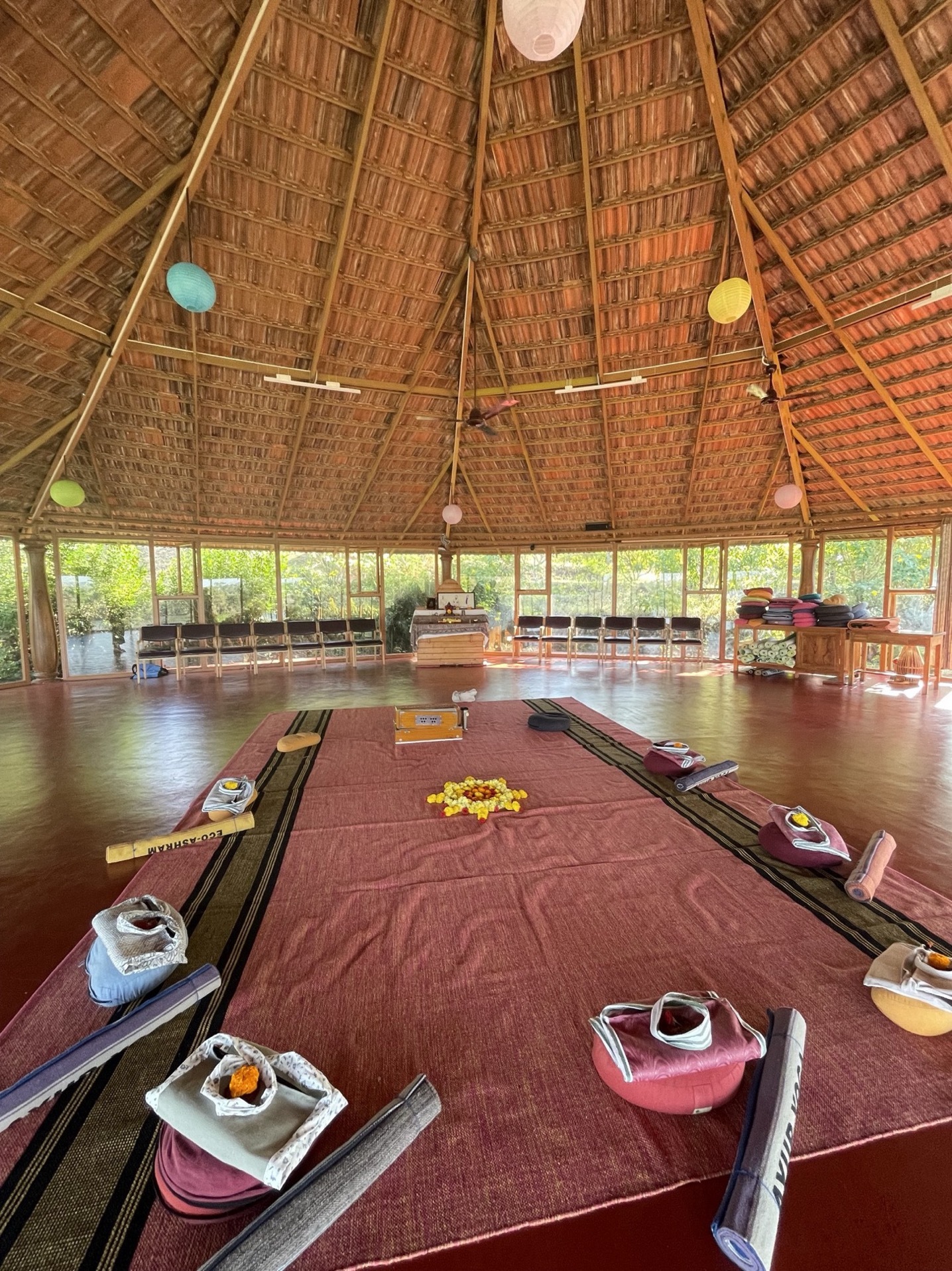 Yoga hall decorated with flowers and candles at AyurYoga Eco-Ashram, India – Christmas and New Year yoga retreat