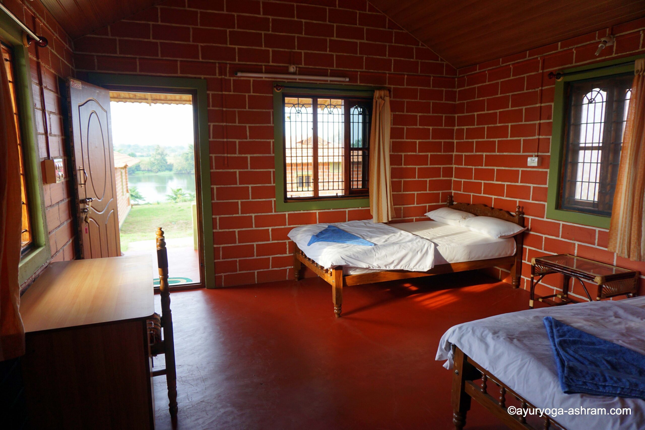 Guest room with river view at the Mysore yoga ashram